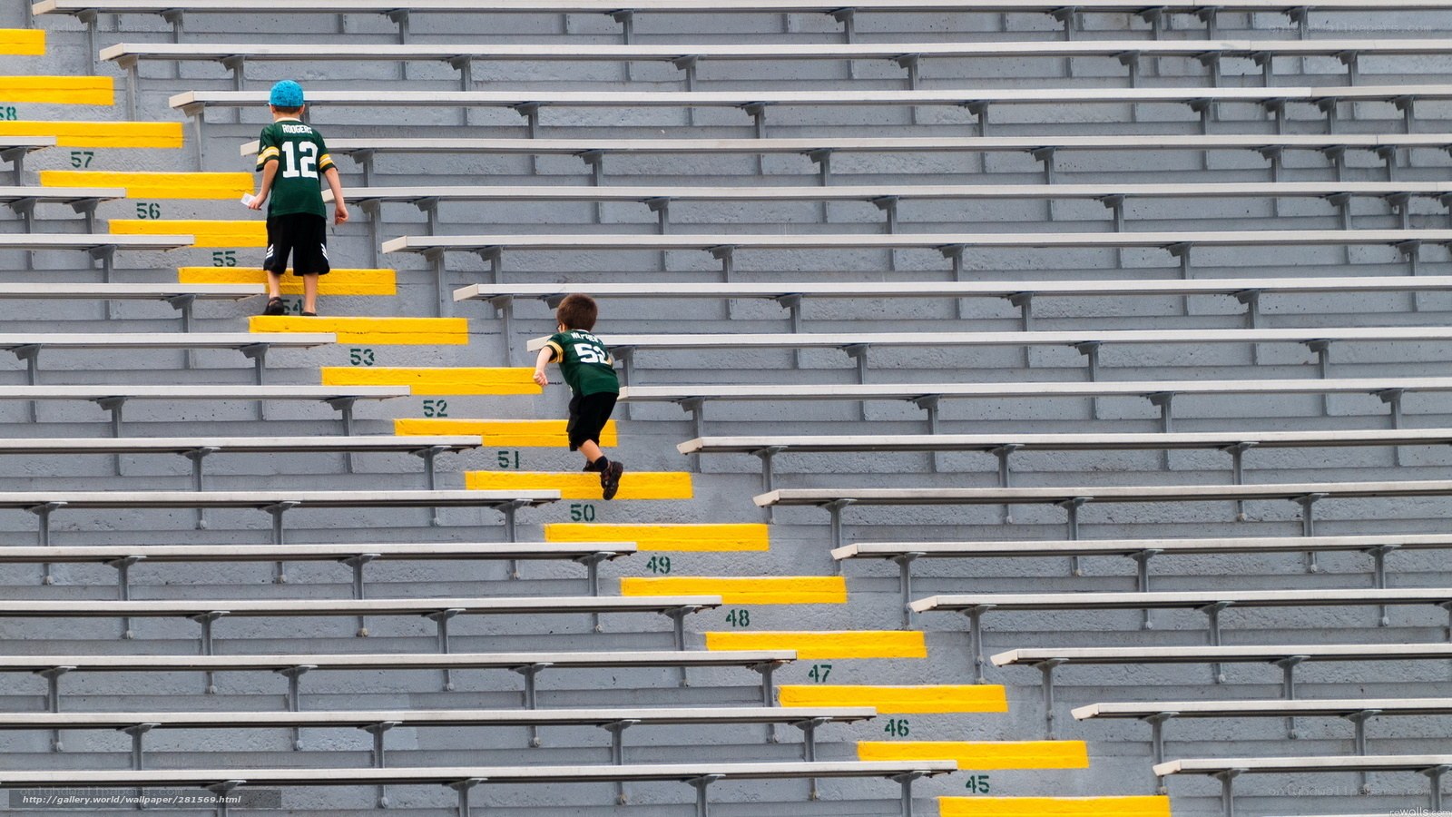 Children climbing stadium stairs