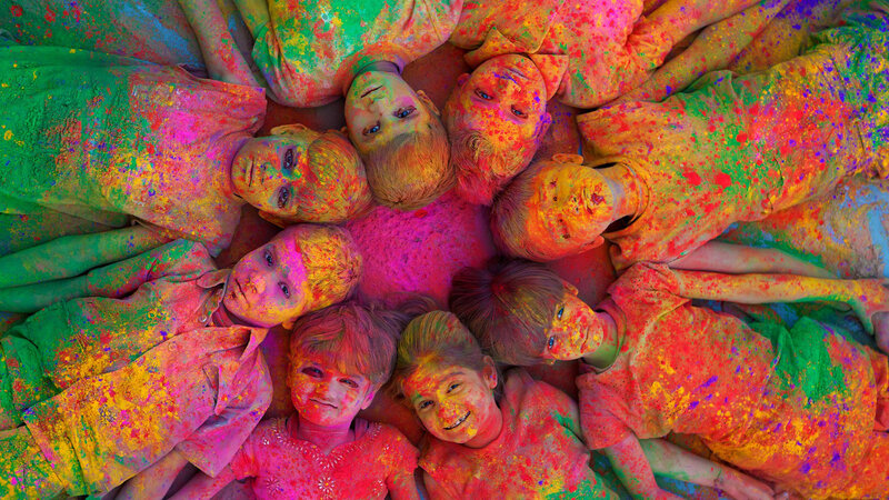 Children Covered in Colored Powder — Pink