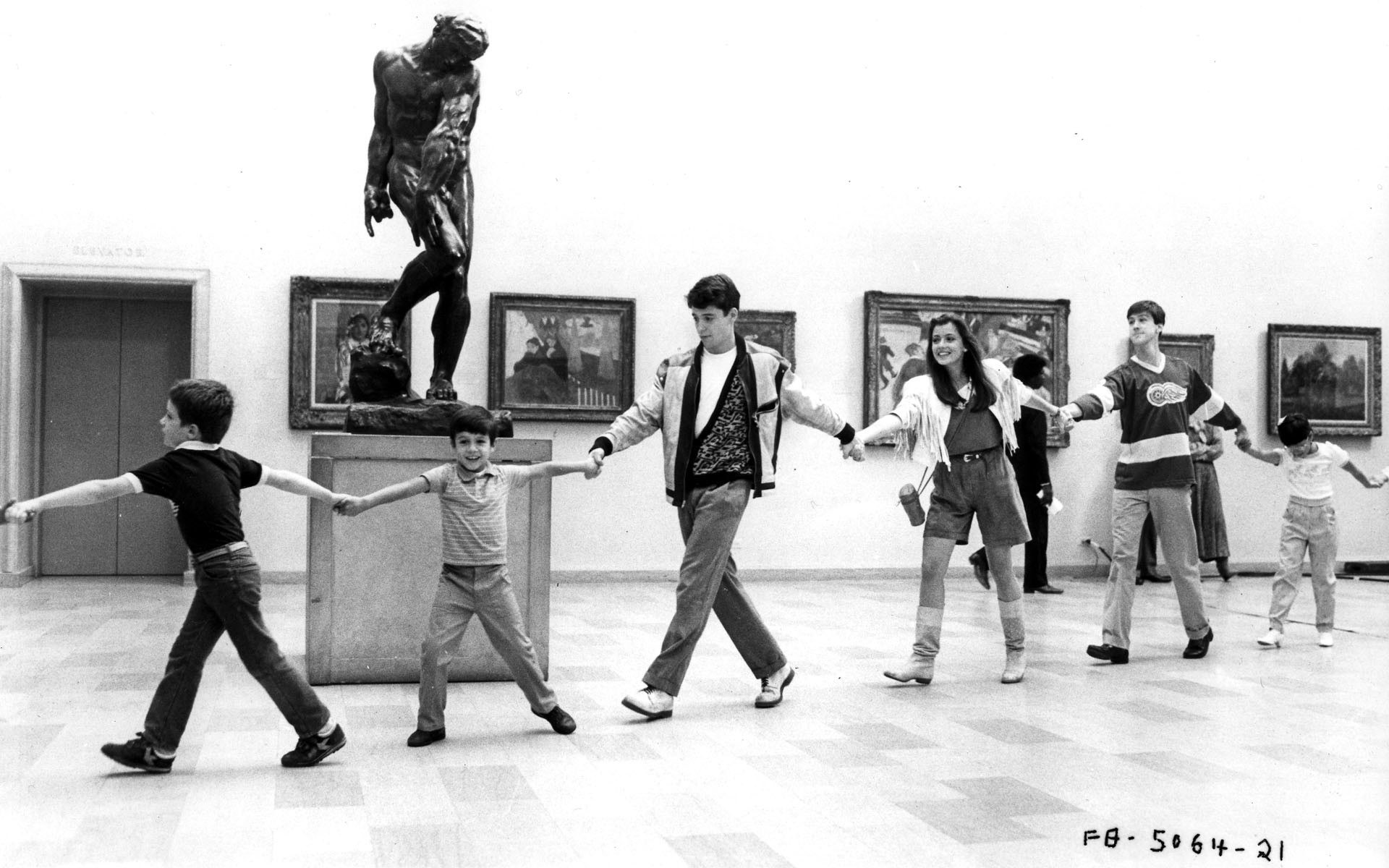 Children dancing in art gallery