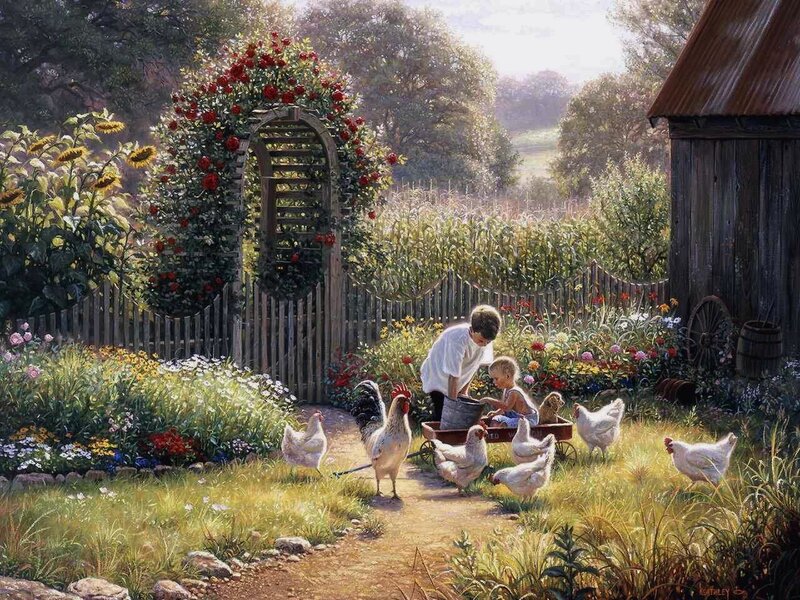 Children feeding chickens in garden