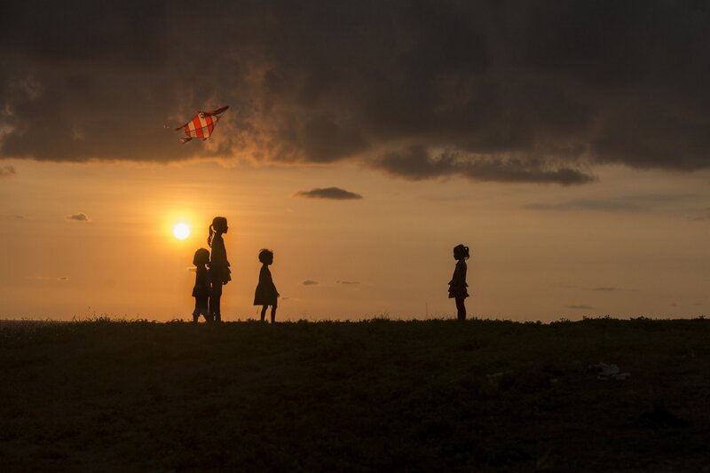 Children Flying Kite — Orange