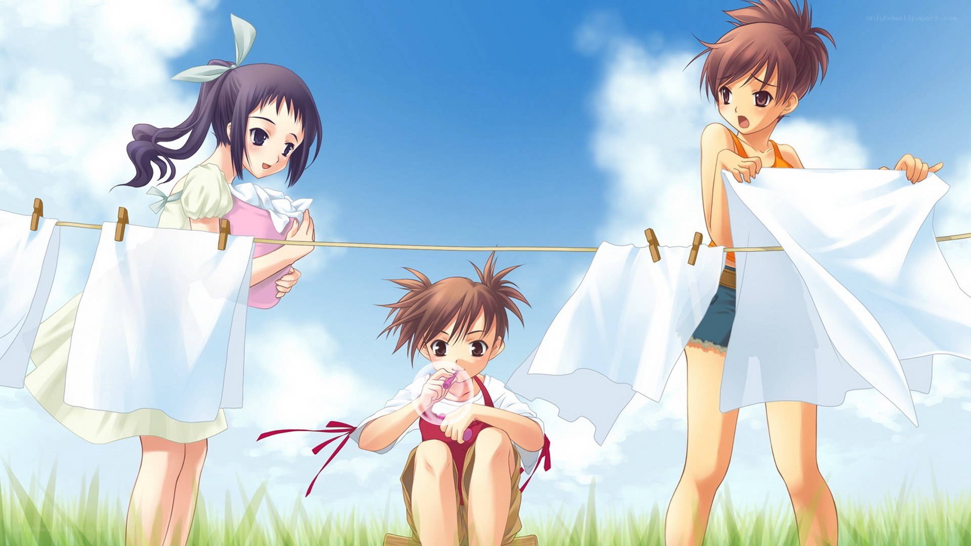 Children hanging laundry on a clothesline