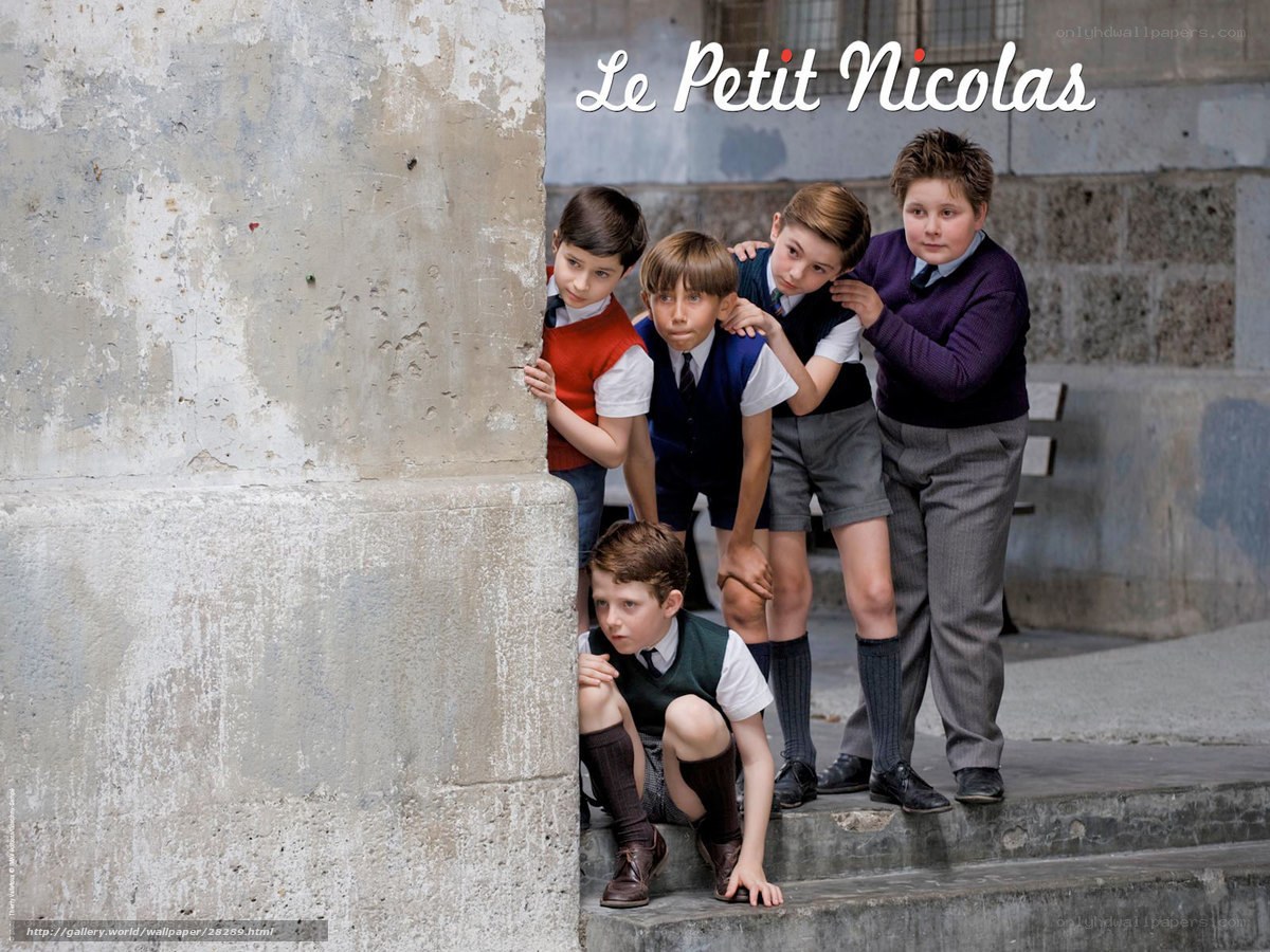 Children hiding behind a wall