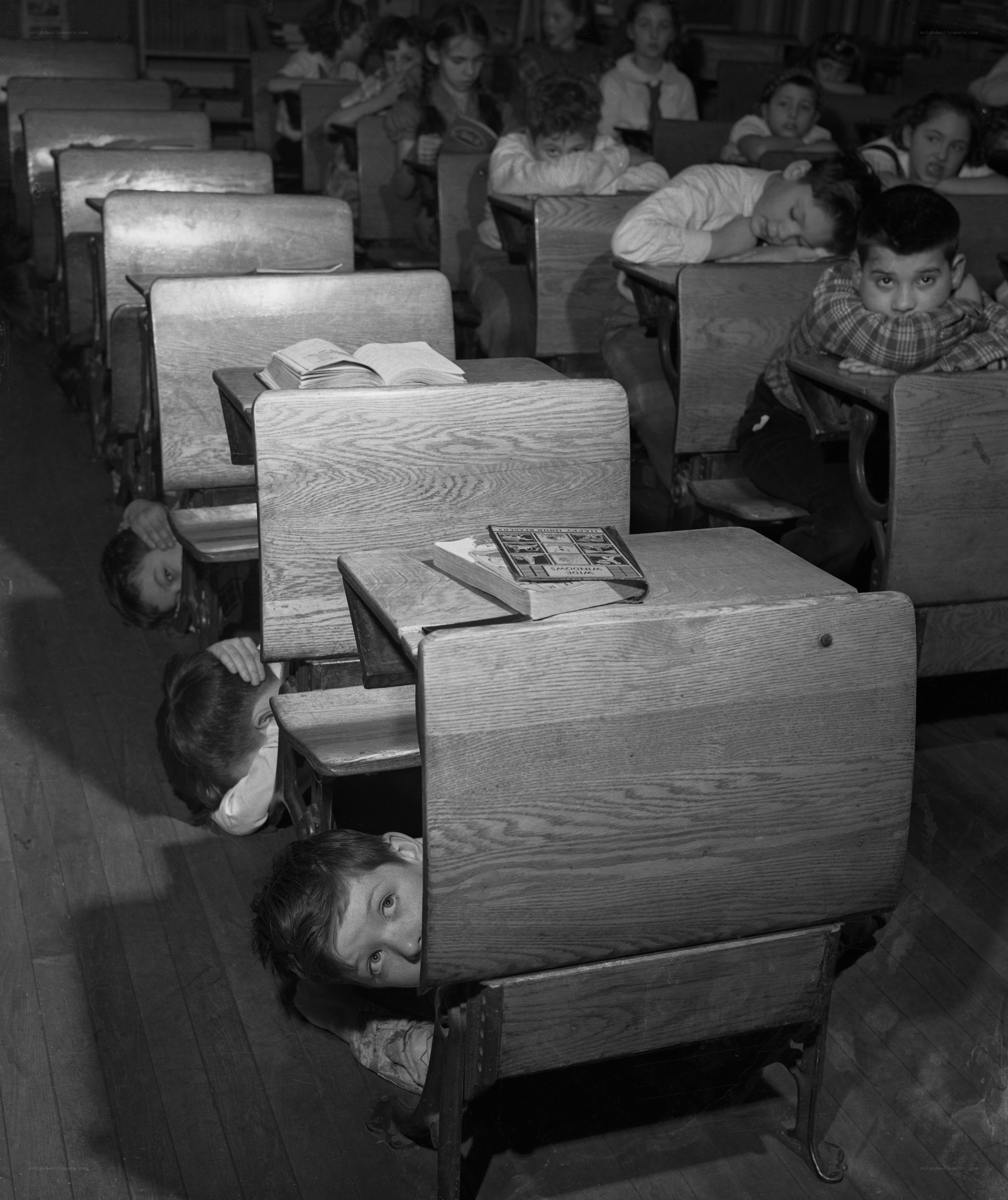 Children hiding under desks