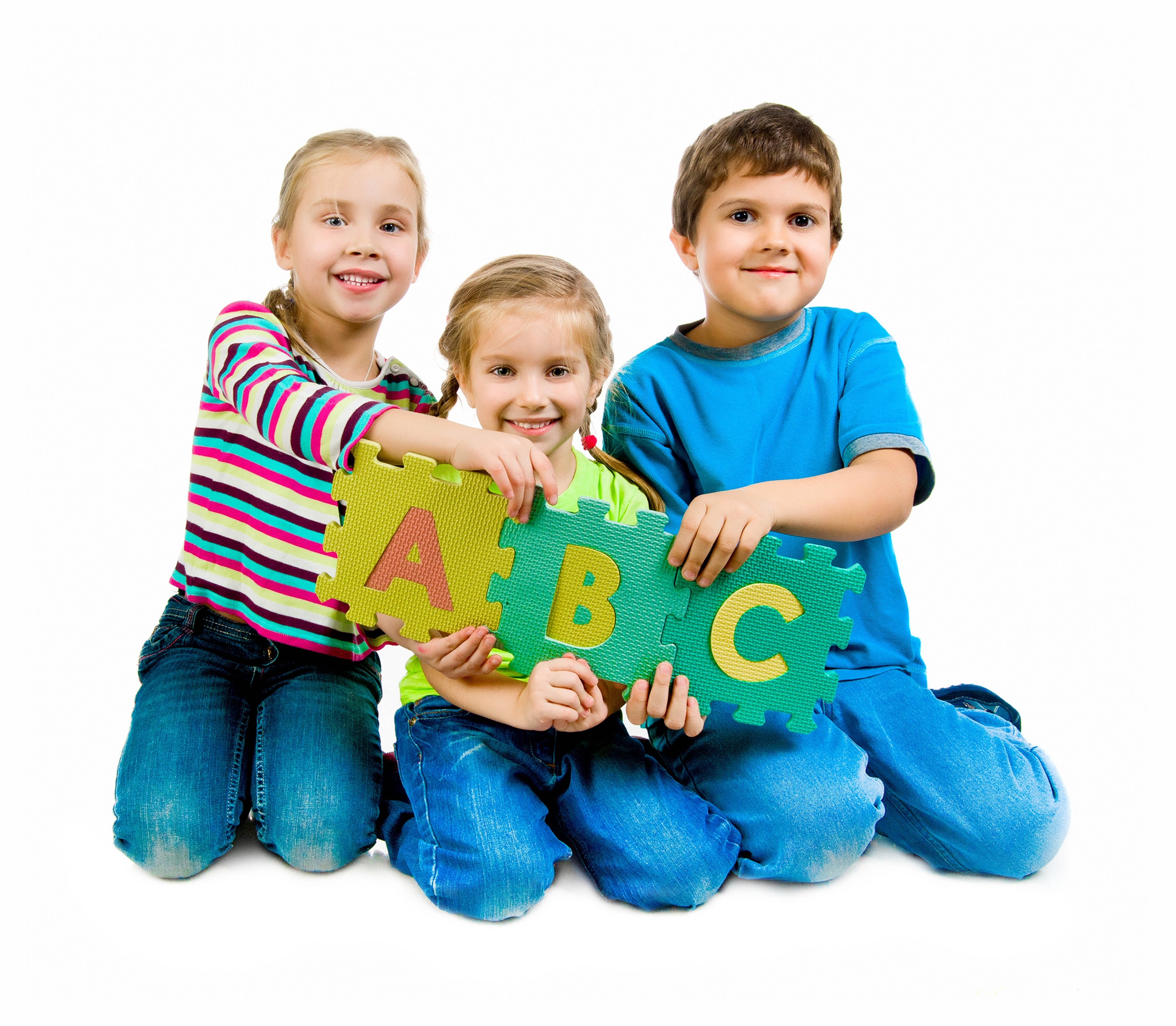 Children holding ABC foam letters