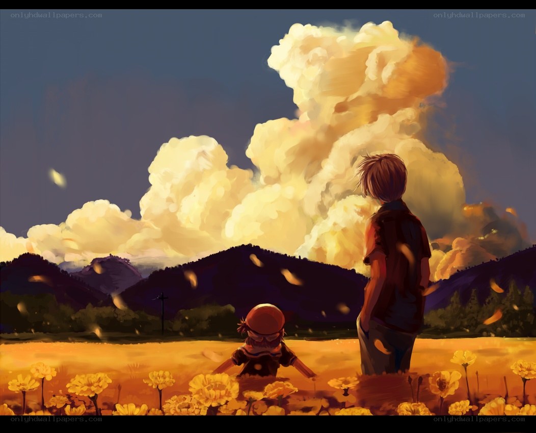 Children in a field at sunset