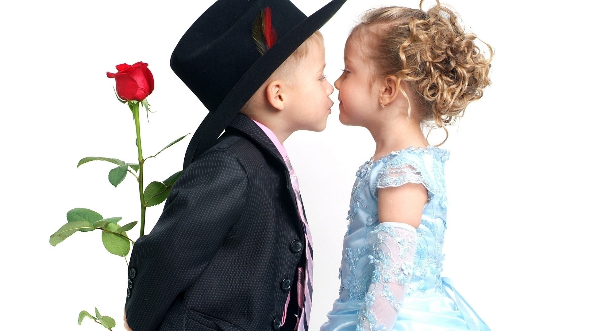 children in formal wear kissing