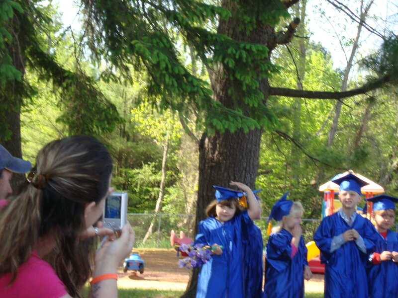 Children in Graduation Gowns