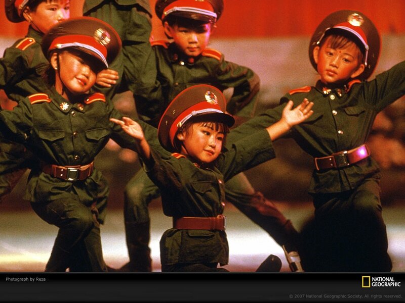 Children in military uniforms performing
