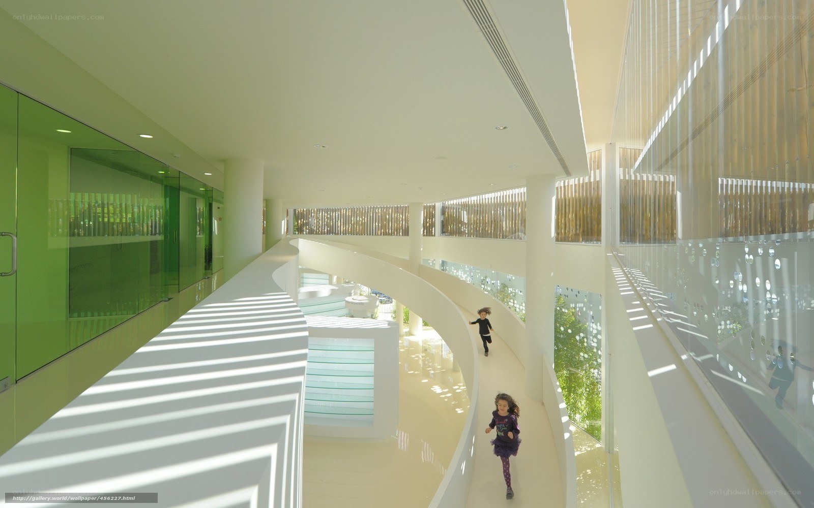 Children in modern building hallway