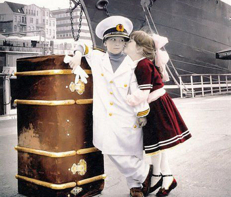 Children in sailor costumes at port