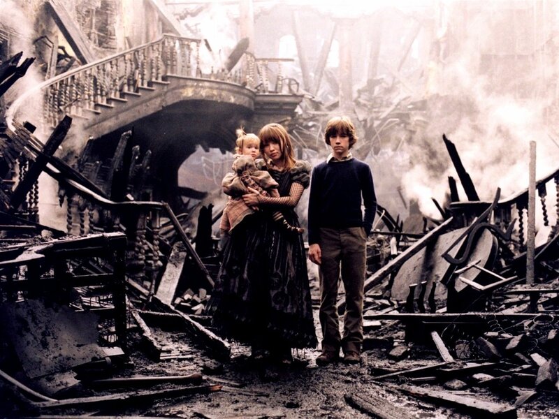 children in war-torn ruins