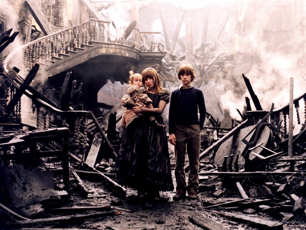 children in war-torn ruins