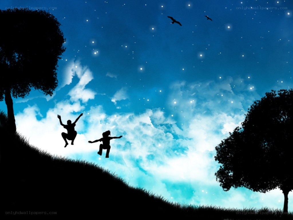 Children jumping on a hill at night