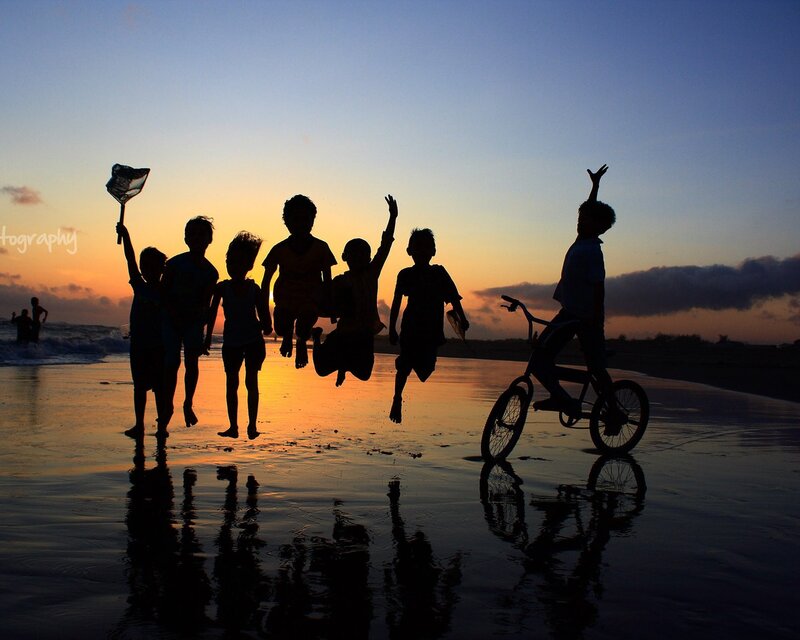 Children Jumping on Beach
