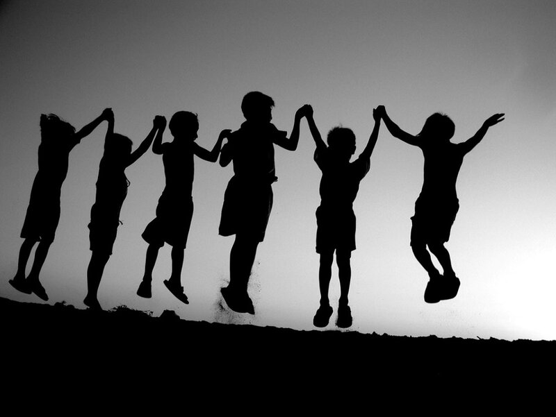 Children Jumping Silhouetted