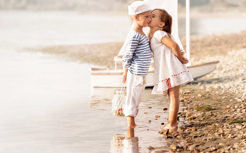 Children Kissing on Beach