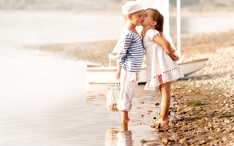 Children Kissing on Beach — White