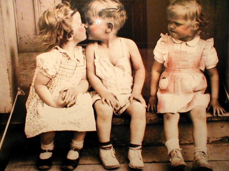 children kissing on steps