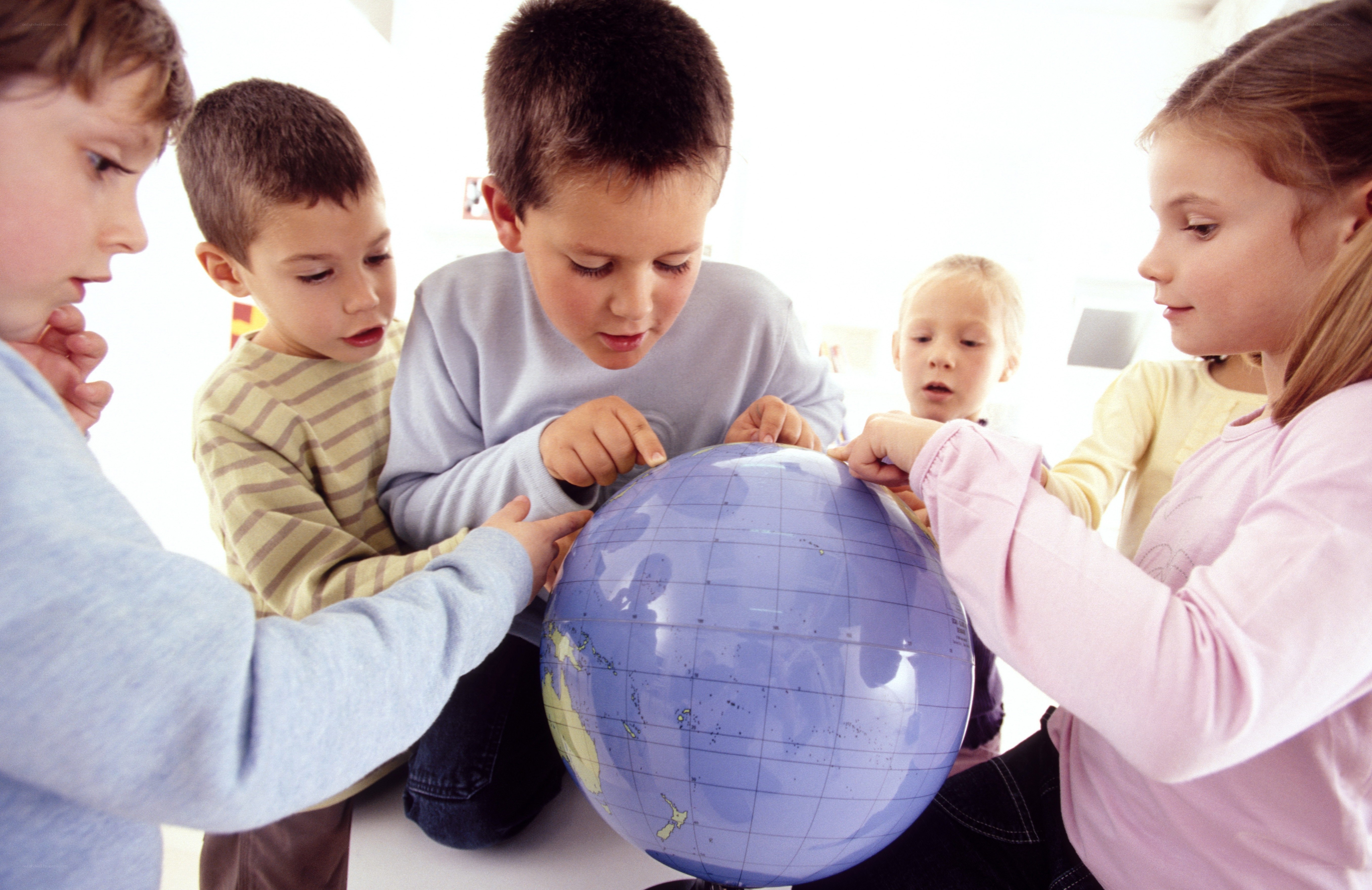 children learning with a globe