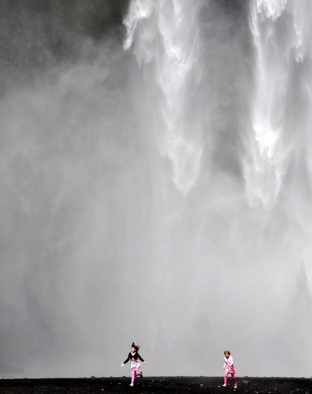 children near a waterfall