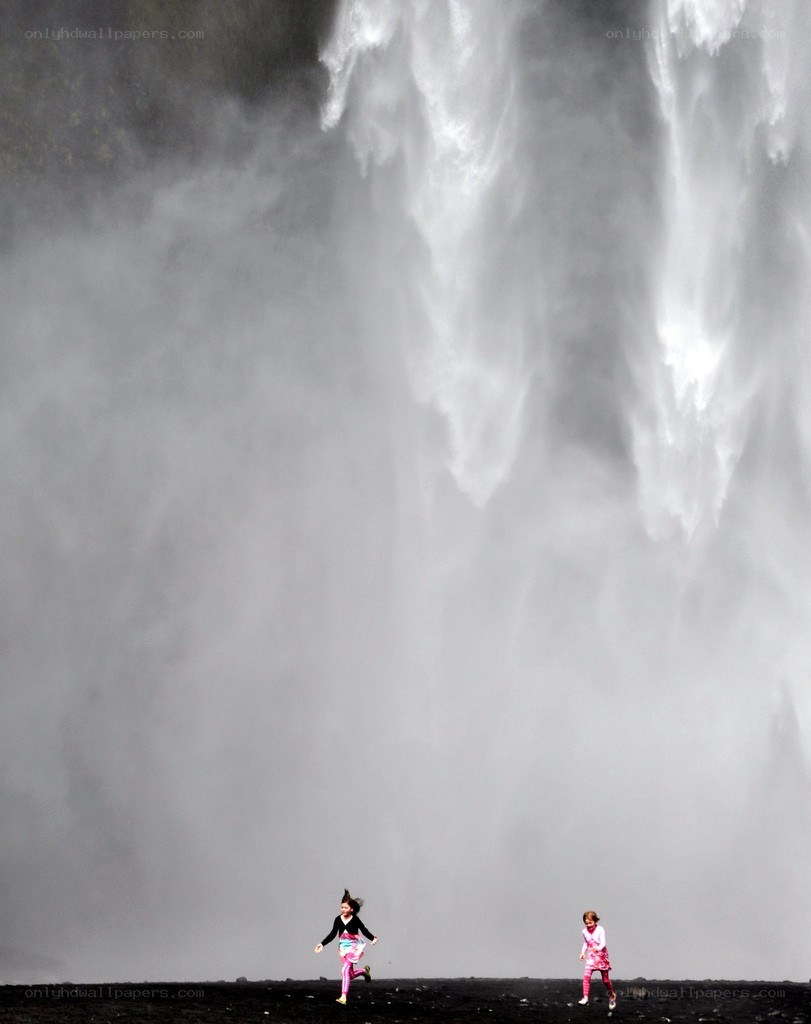children near a waterfall