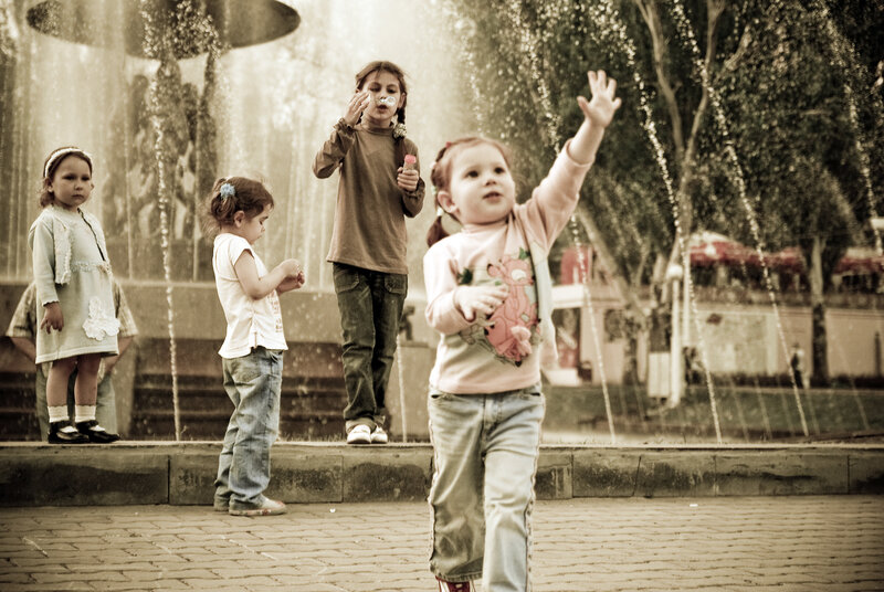 Children Near Fountain — Sepia