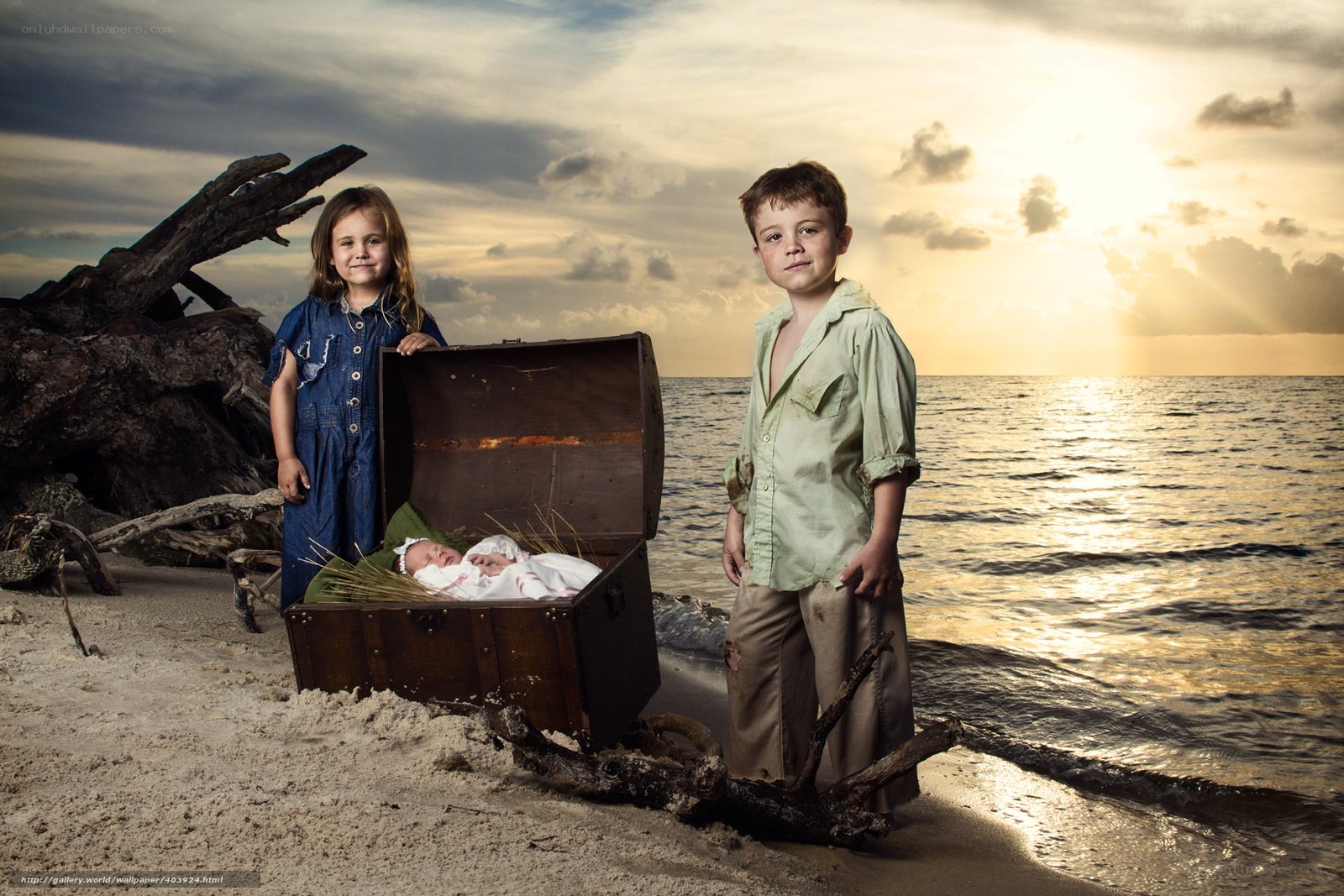 Children on a beach with a treasure chest