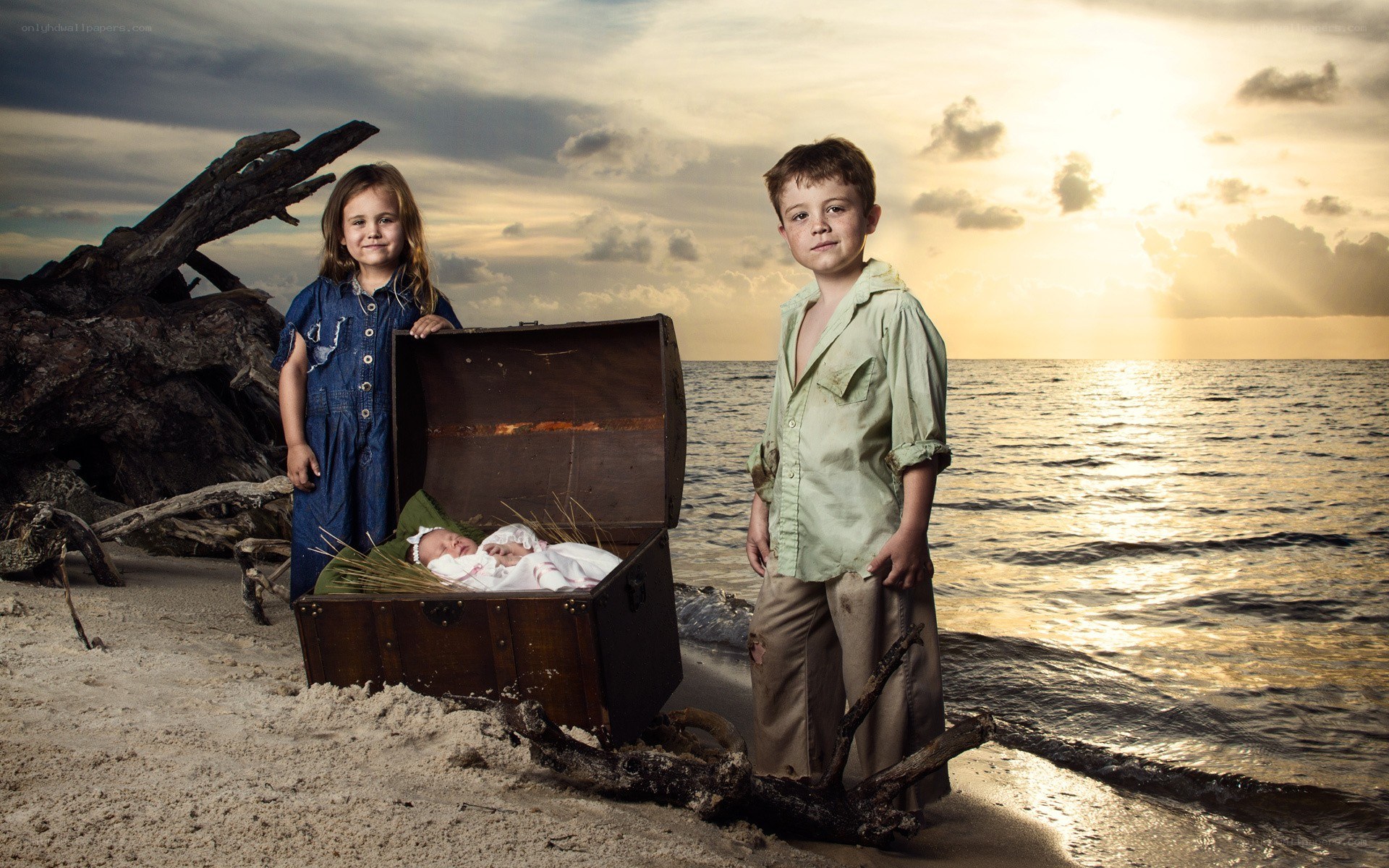 children on a beach with treasure chest