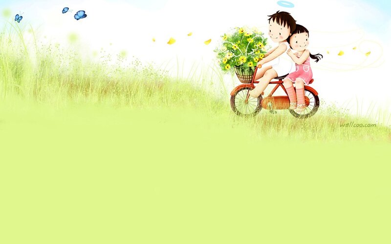 children on a bike in a field