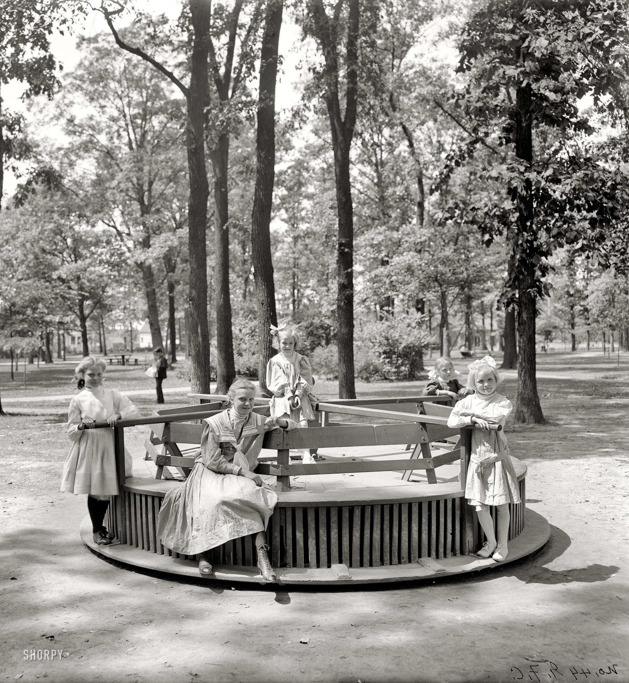 Children on a carousel in a park