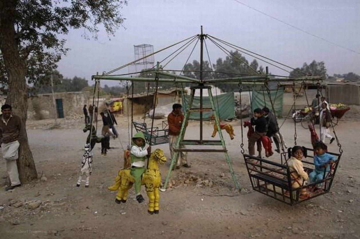 Children on a carousel in Pakistan