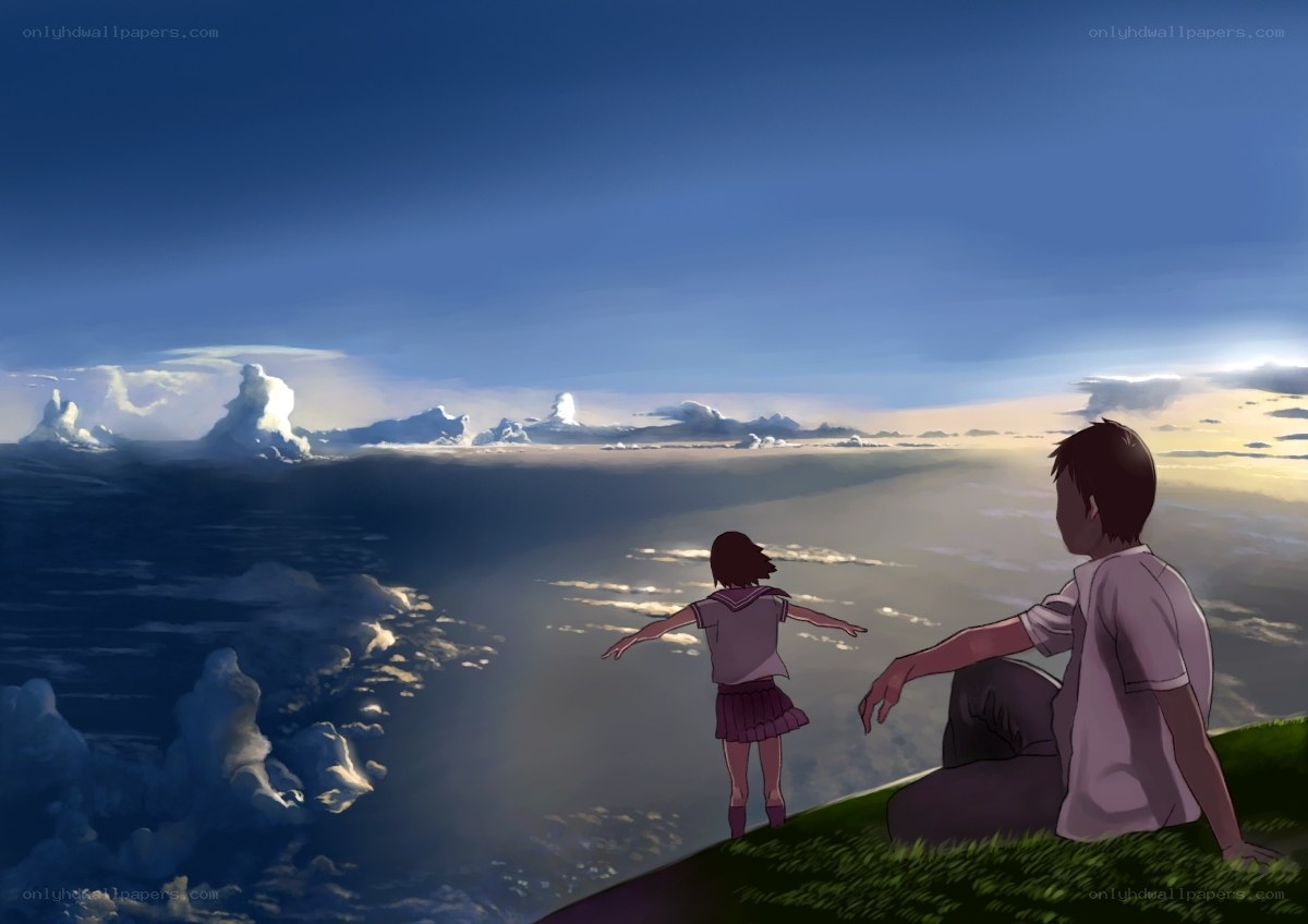 children on a cliff at sunset