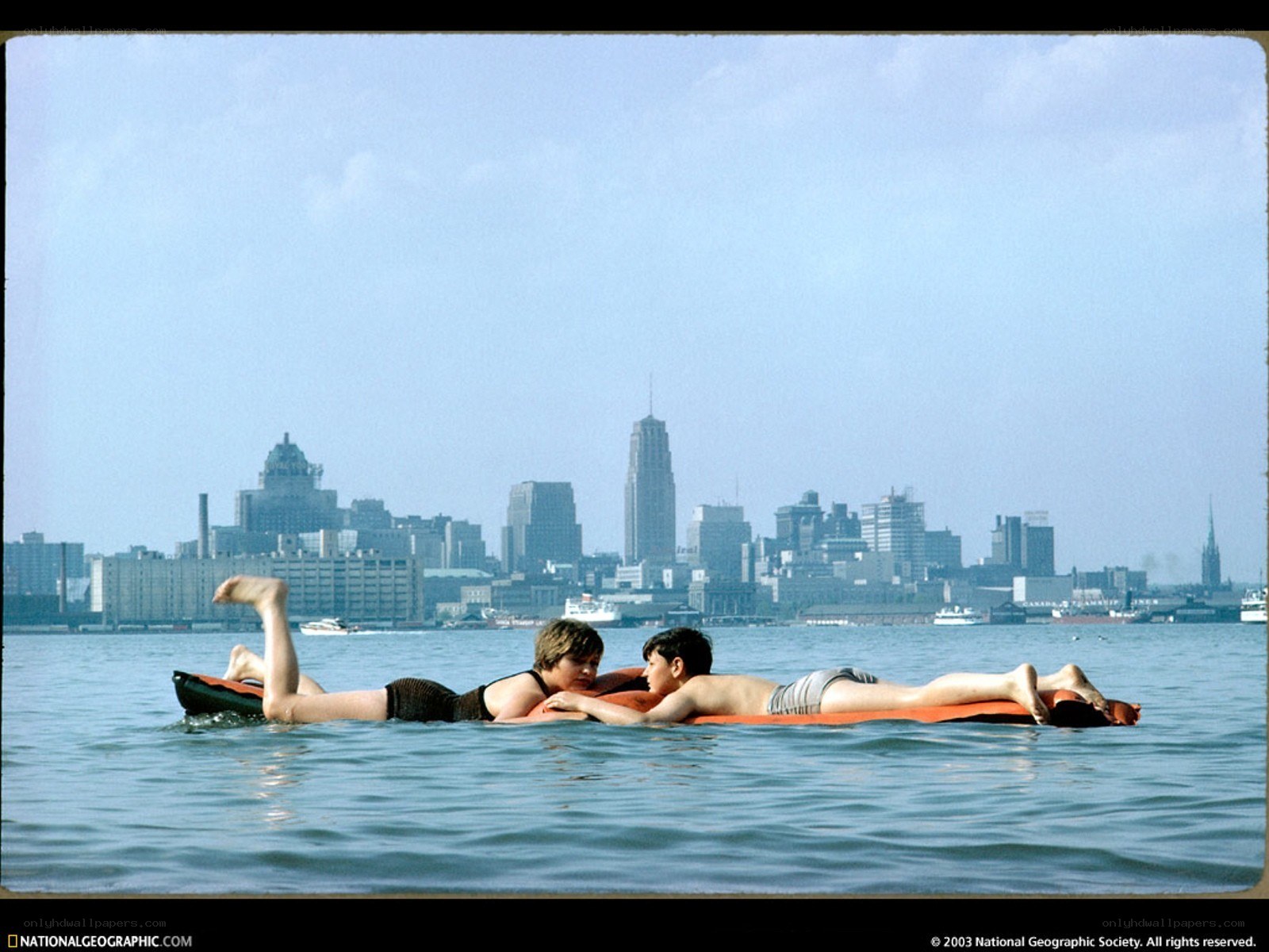 Children on a float in the harbor