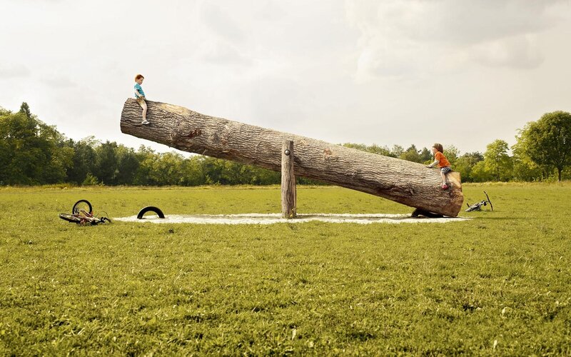 Children on a giant seesaw