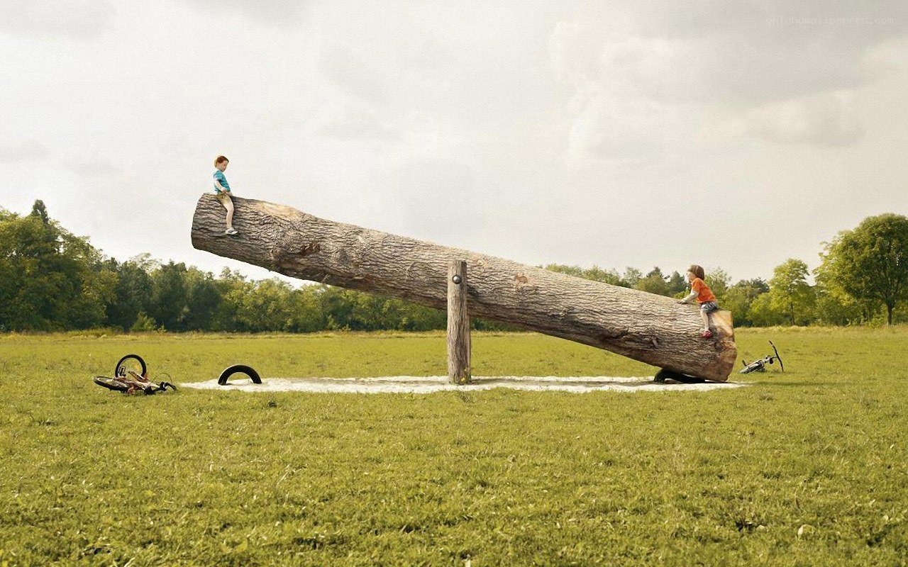 Children on a giant seesaw