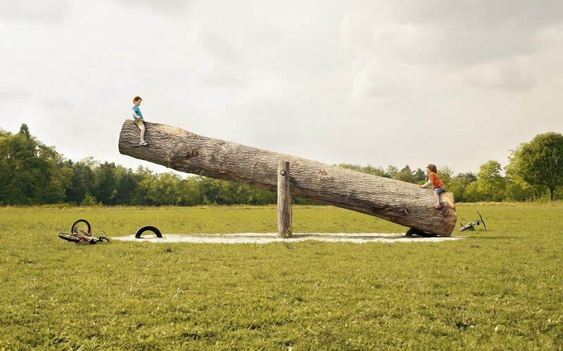 Children on a giant seesaw