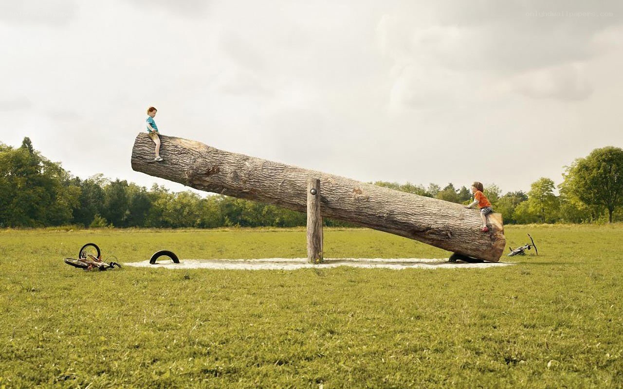 Children on a giant seesaw