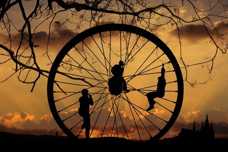 Children on a giant wheel at sunset