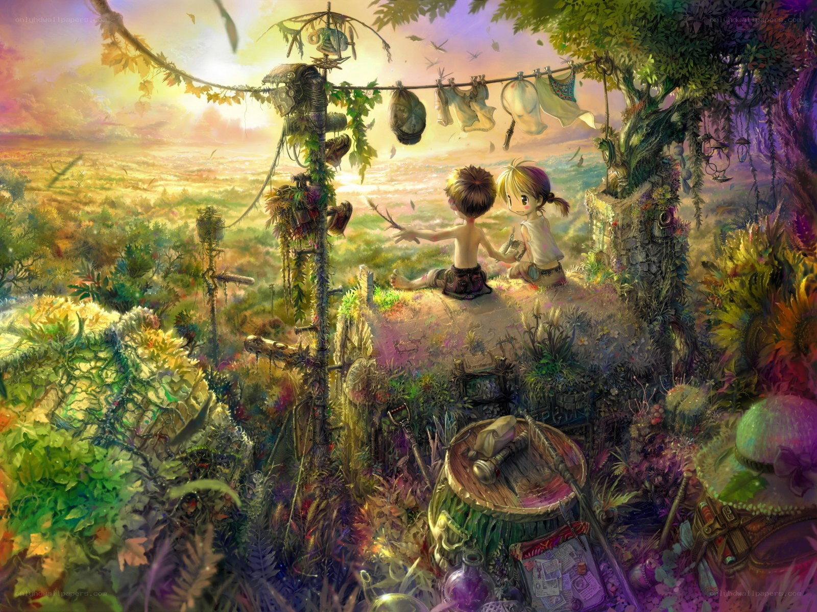 Children on a hill at sunset