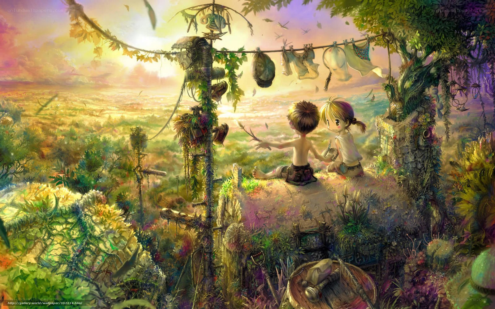 Children on a hill at sunset