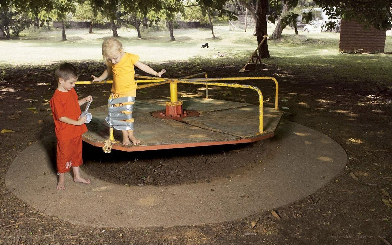 Children on a playground carousel