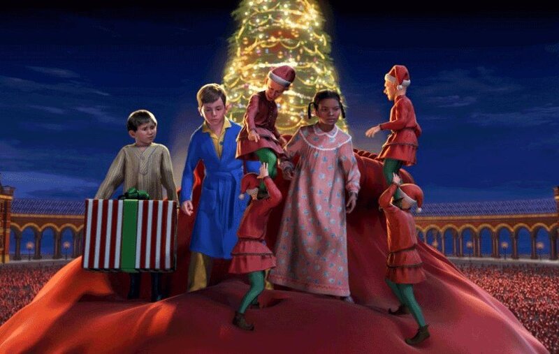 Children on a red slide with Christmas tree