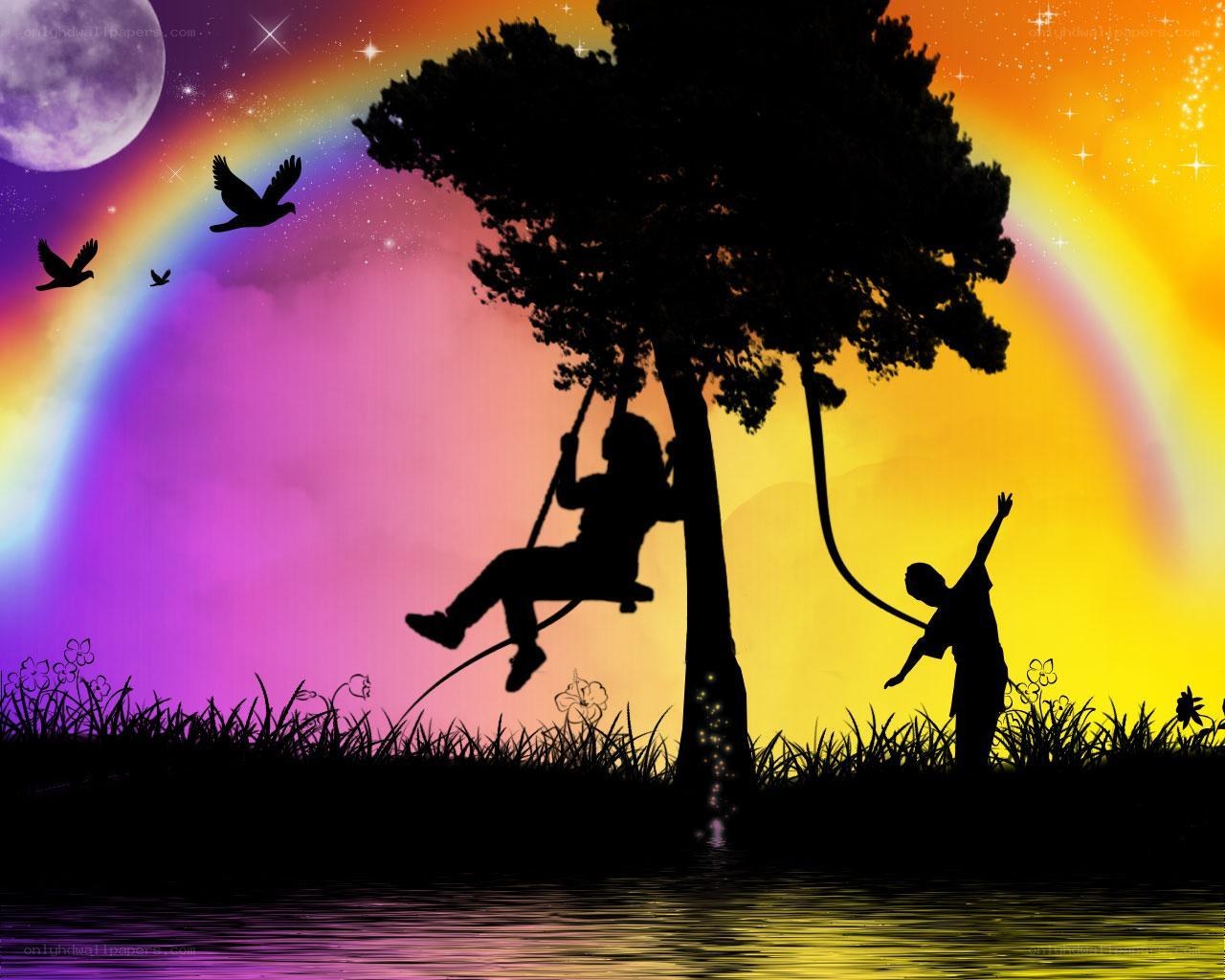 Children on a swing at sunset