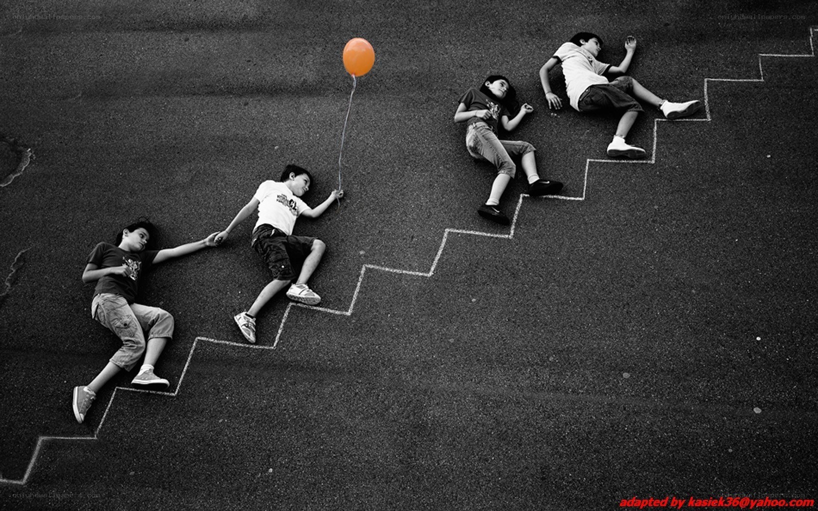 Children on chalk stairs with balloon