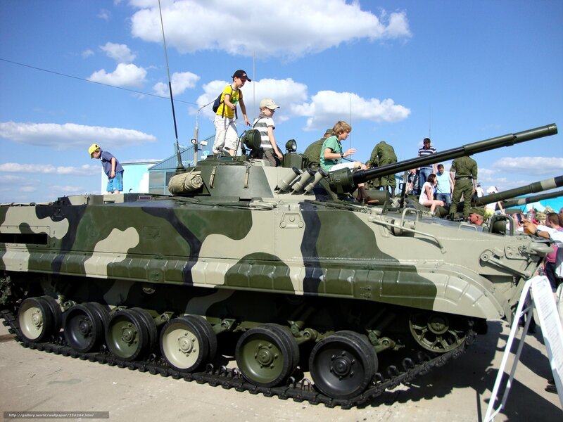 Children on military tank