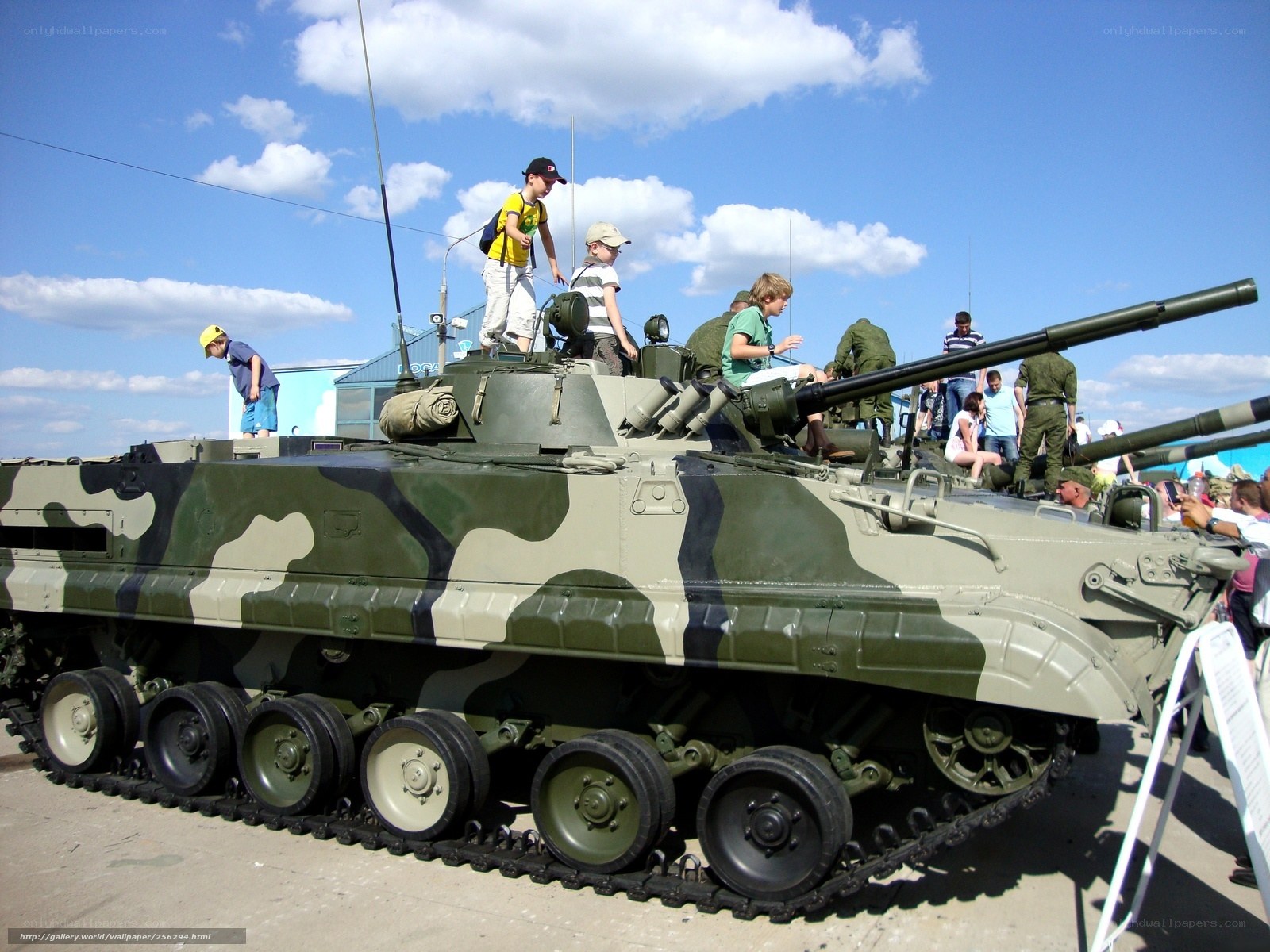 Children on military tank