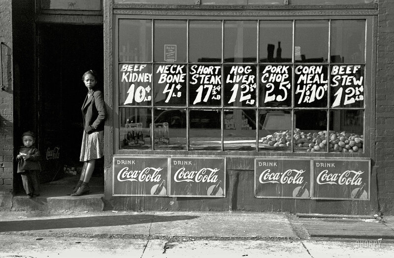 Children outside a butcher shop