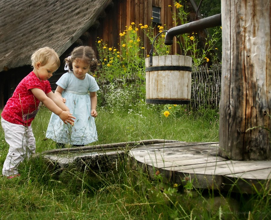 Children playing at a well