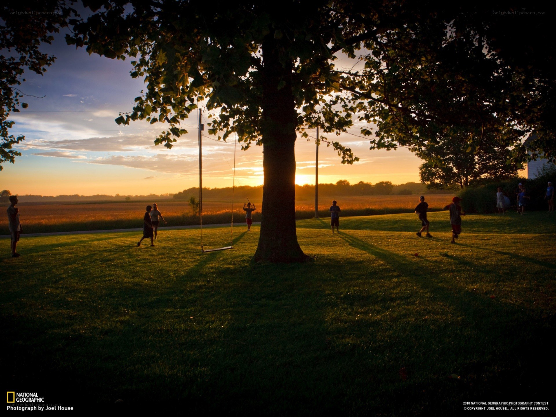 Children playing at sunset